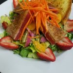 Salad with seared tuna, strawberries, and toast—perfect for Outdoor Dining Prescott at Augie’s.