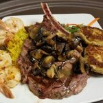 Grilled steak with mushrooms, shrimp, rice, and veggies—classic Steakhouse Prescott flavors.