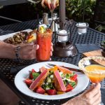 Seared tuna salad and cocktails enjoyed on an outdoor table—outdoor dining Prescott style.