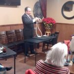 A man in a suit performs a rope trick for guests at Augie’s Banquet Rooms Prescott.