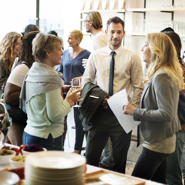 People socializing and talking at a casual networking event in Banquet Rooms Prescott.