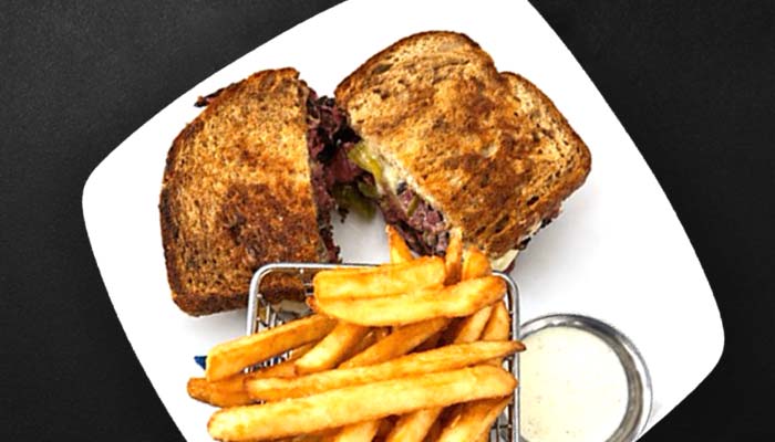 Sandwich with fries and dipping sauce, perfect for outdoor dining in Prescott’s fresh air.